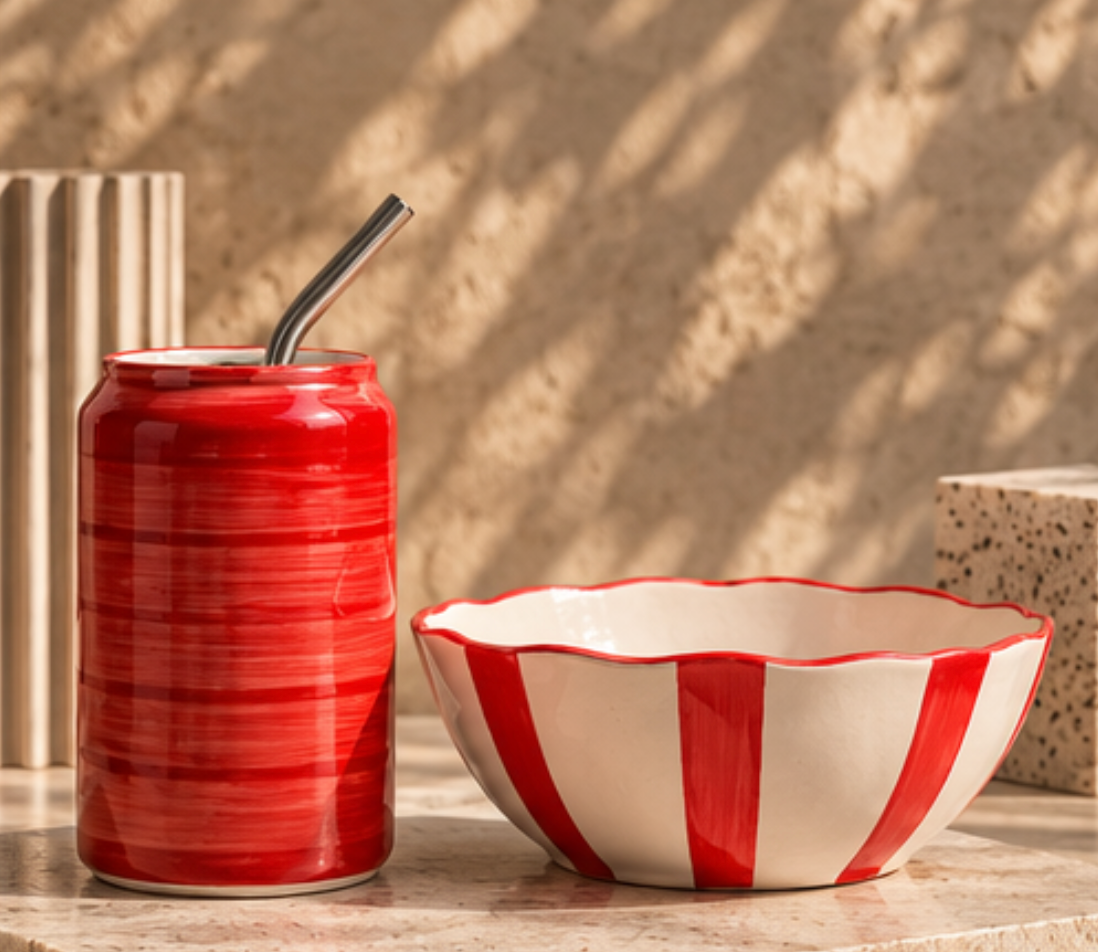 Coca-Cola ceramic tumbler and striped popcorn bowl side view