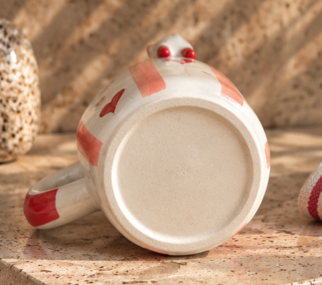 Side view of white Cat Hearts Mug with pink stripes and red heart details